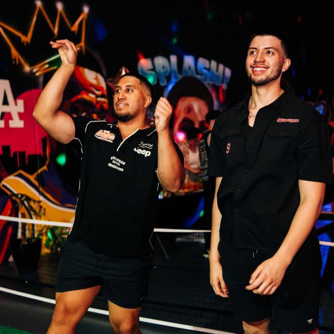 Happy staff enjoying their work function playing basketball